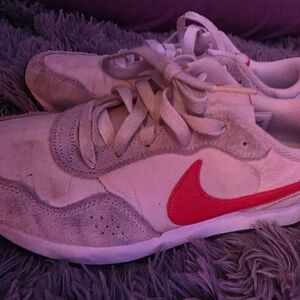 Nike Sneakers with Orange Swoosh